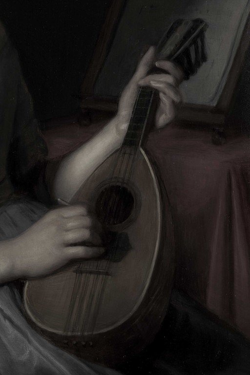Hands Playing Classical Guitar in Dramatic Lighting