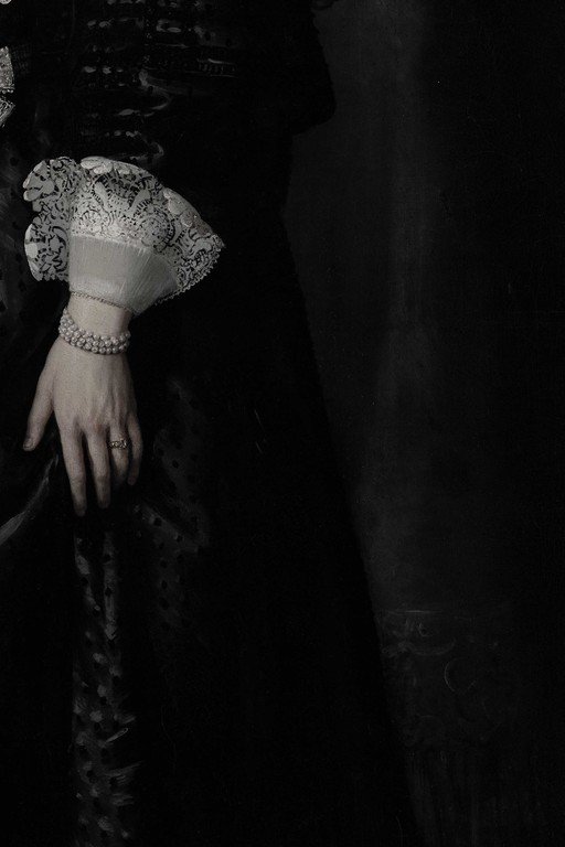 Elegant Hand with Lace Glove and Pearl Jewelry