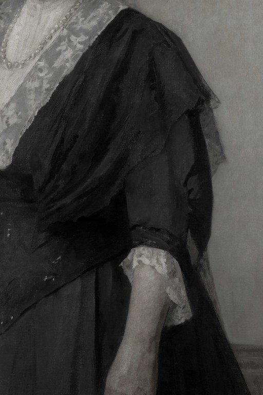 Figure in Black Draped Fabric with Lace Detail