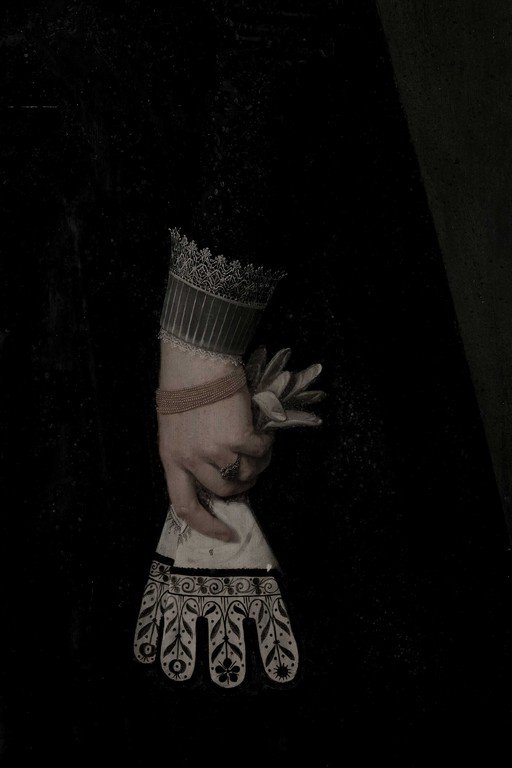 Surreal Portrait with Ornate Headpiece and Decorative Gloves