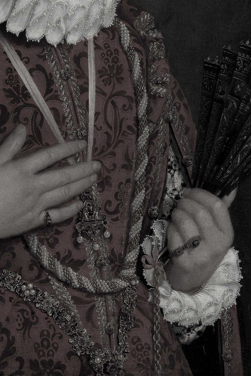 Victorian-Era Woman in Ornate Dress with Decorative Fan