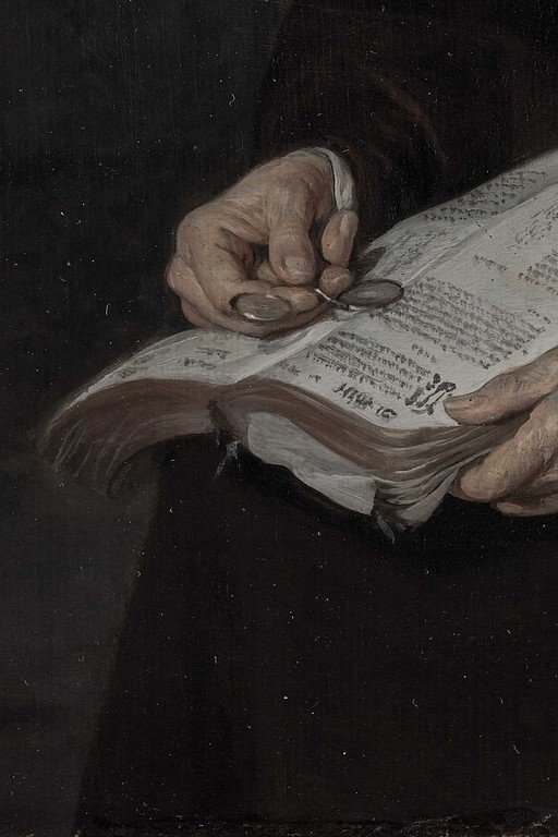 Hands Holding Open Book on Dark Background
