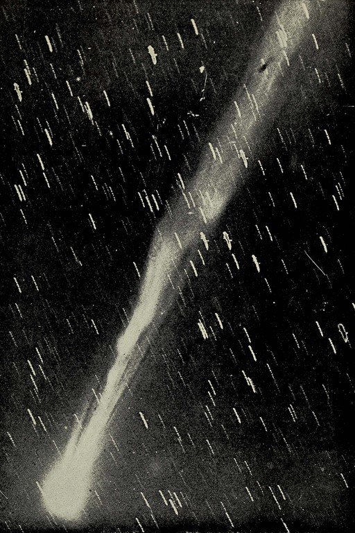 Comet Streaking Through Starry Night Sky