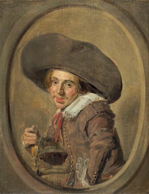 Man in a Large Hat Holding a Drink