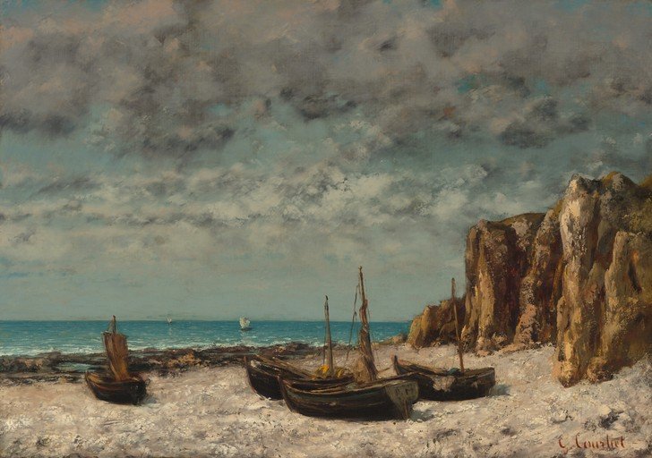 Boats on a Rocky Shore Under a Cloudy Sky
