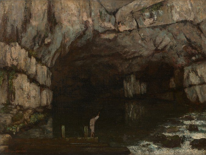 Man in Cave Entrance with Water