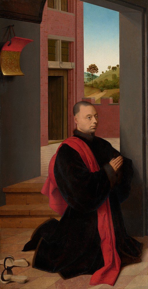 Man in Black and Red Robes Kneeling in Prayer