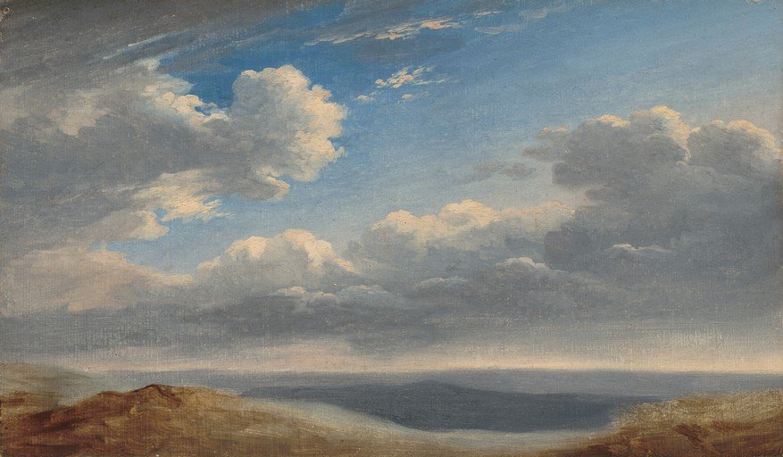 Dramatic Sky Over Rolling Hills and Sea