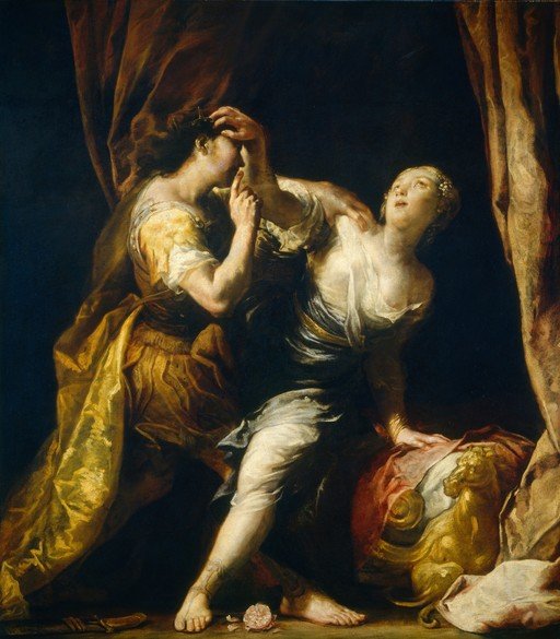 Two women in dramatic scene with golden lion sculpture