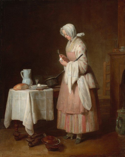 Woman Preparing Food in a Kitchen