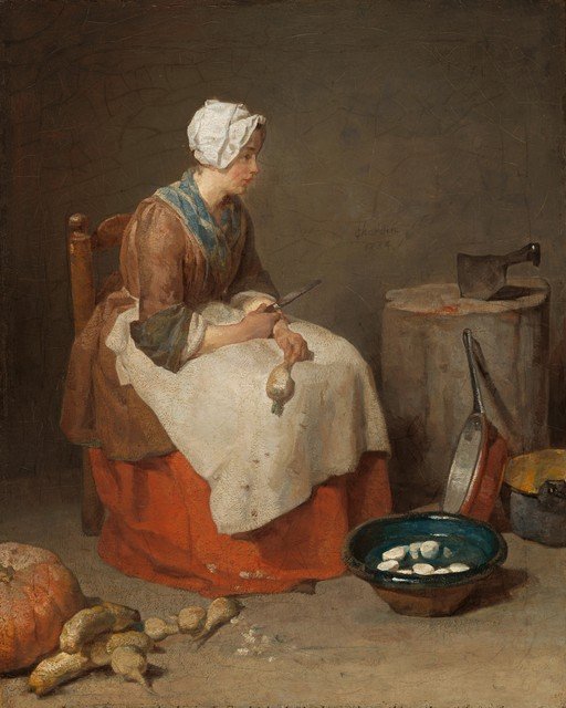 Woman Peeling Vegetables in a Kitchen