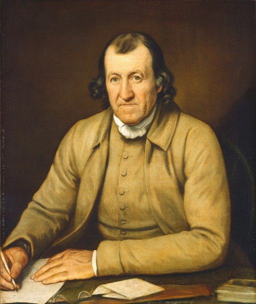 Portrait of a Man in a Tan Coat Writing at a Desk
