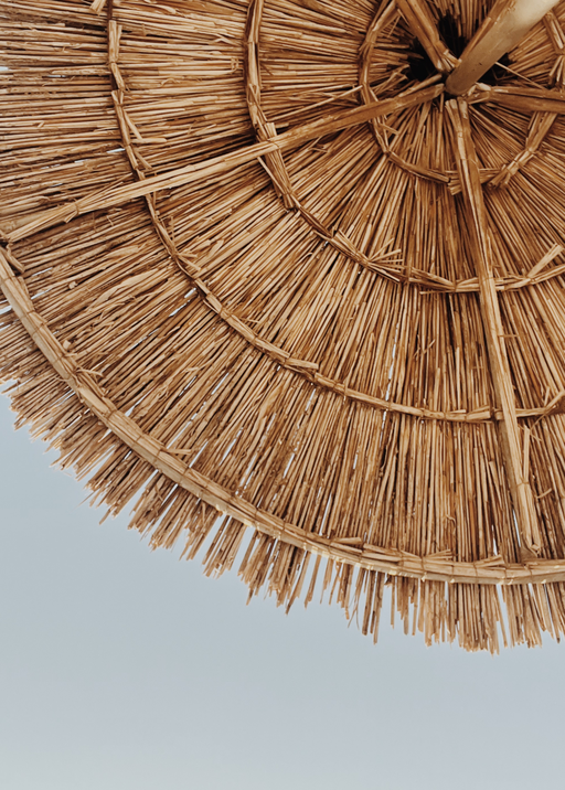 Close-up of a Natural Straw Beach Umbrella