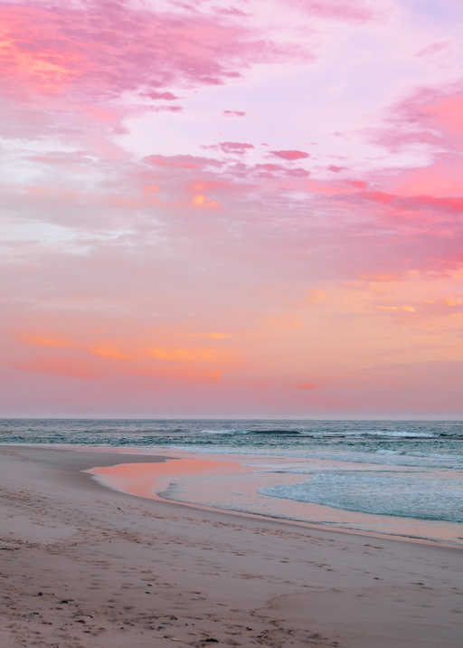 Serene Beach Sunset with Pink and Orange Clouds