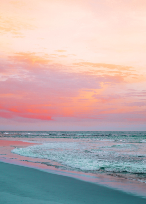 Serene Beach Sunset with Pink and Orange Hues
