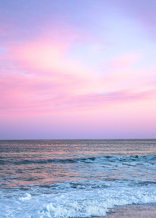 Pastel Sunset Over Gentle Ocean Waves