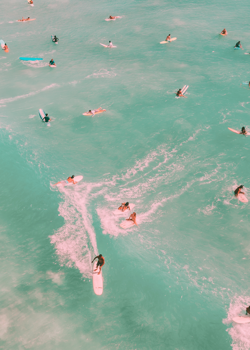 Surfers Enjoying Turquoise Waters