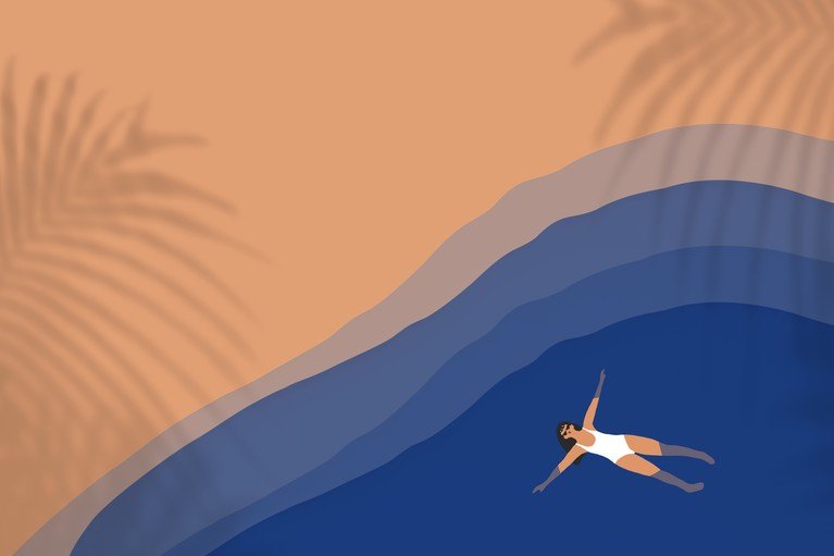 Woman Floating in Ocean with Palm Shadows