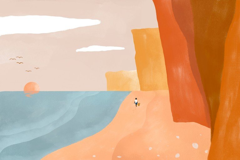 Person and dog walk on a beach at sunset