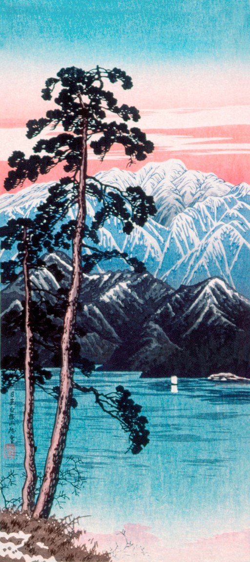 Pine Trees and Snow-Capped Mountains Over a Lake
