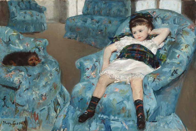 Young Girl in a Blue Armchair with a Dog