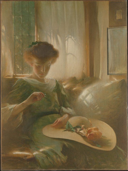 Woman in Green Dress Examining a Ring