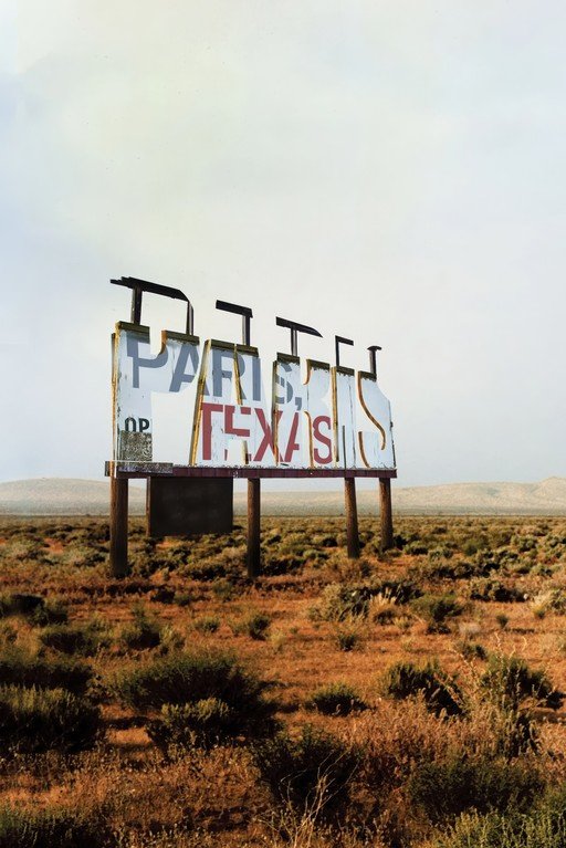 Paris, Texas Sign in Desert Landscape