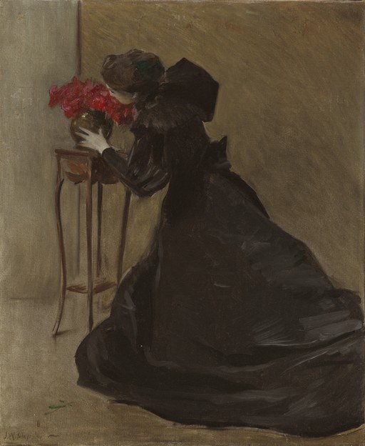 Woman in Black Dress Admiring Red Flowers