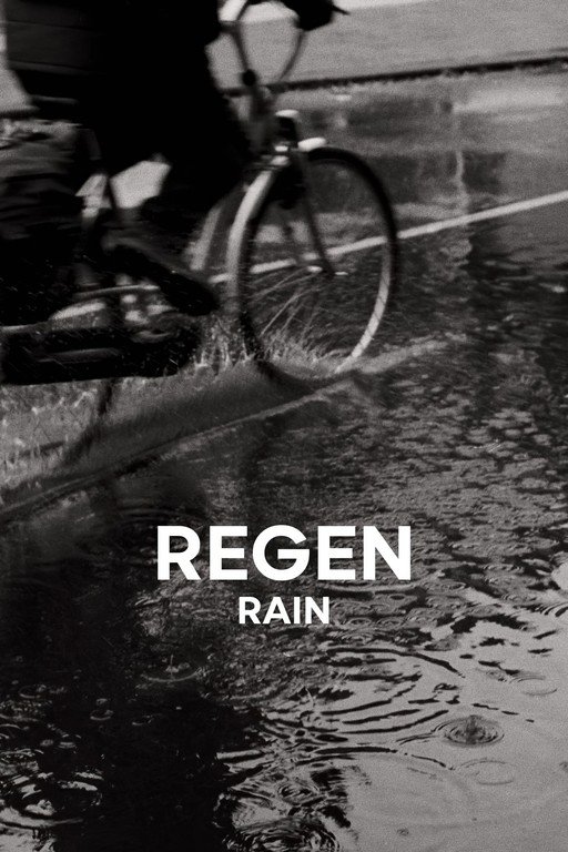 Cyclist Riding Through Rain